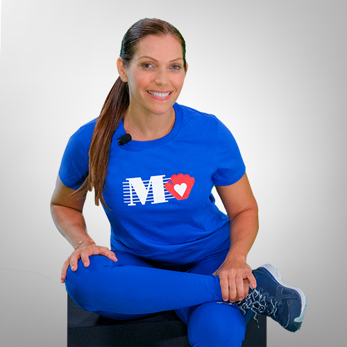 Fitness trainer demonstrating a seated figure 4 stretch