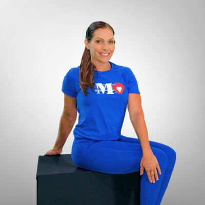 Fitness trainer demonstrating a seated spinal twist